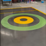 Custom self-levelling resin game lane with a bold target design in Birmingham.