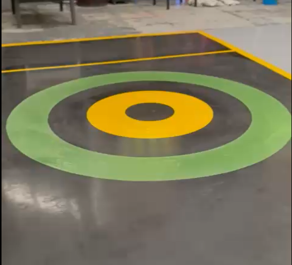 Custom self-levelling resin game lane with a bold target design in Birmingham.